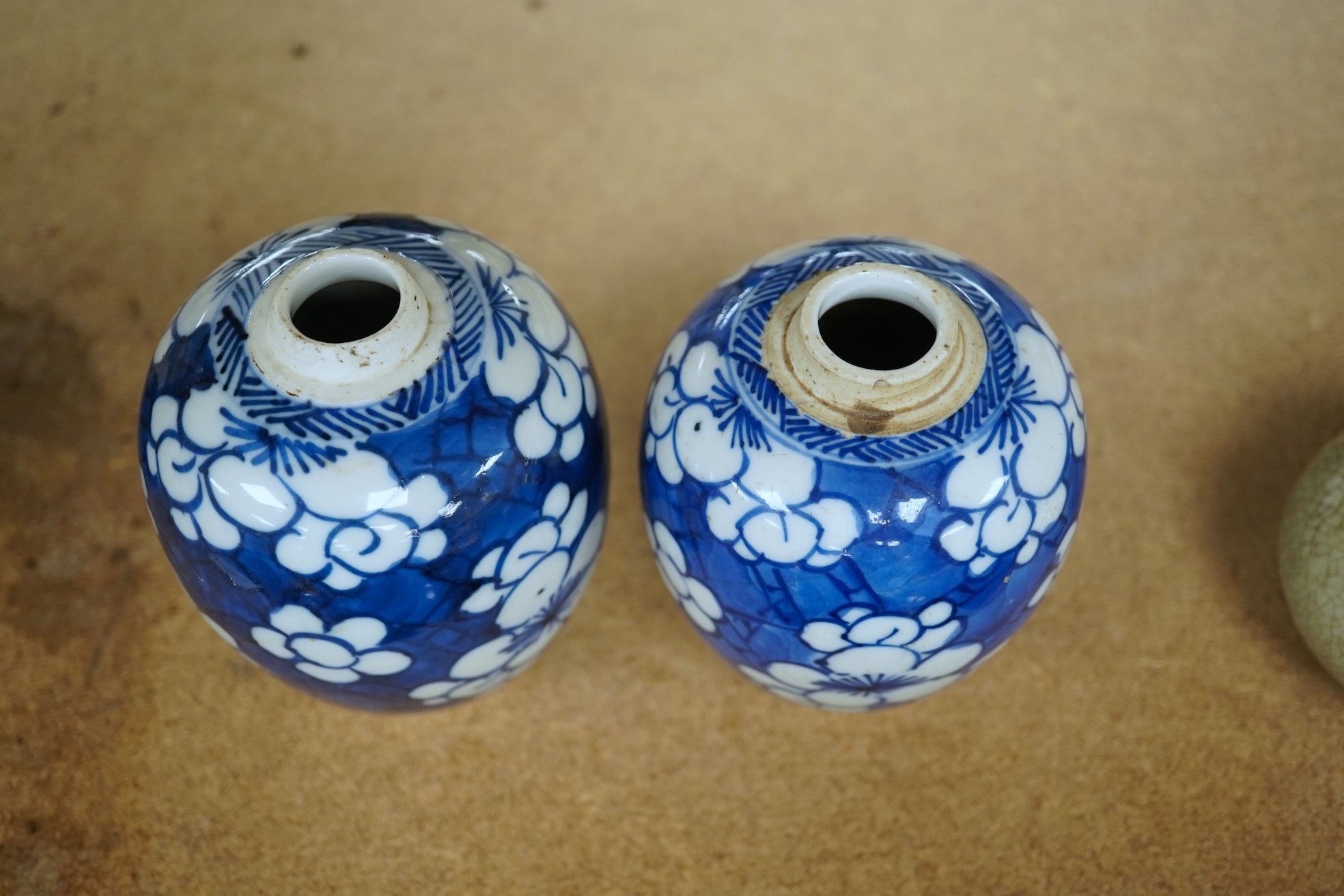 Two small Chinese blue and white prunus jars, Kangxi period, tallest 9.5cm. Condition - good